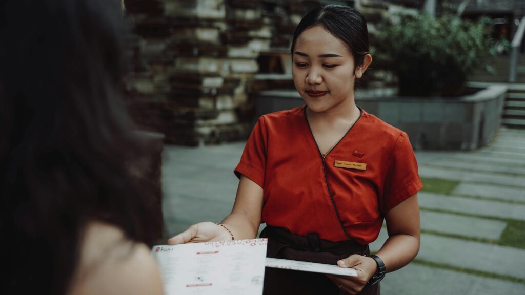 Marketing professional conducting face-to-face customer outreach